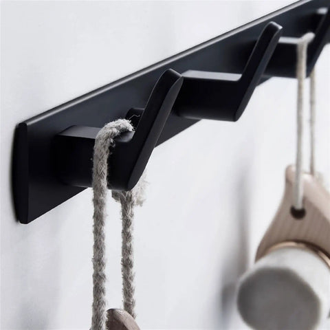 Tough As Nails Wall Mounted Coat Hooks With Slick Black Finish, showcasing hooks holding ropes for bags or coats.