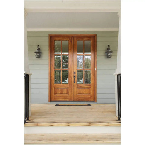 Burlington Two Light Wall Lantern In Oil Rubbed Bronze Finish on porch flanking double wooden doors