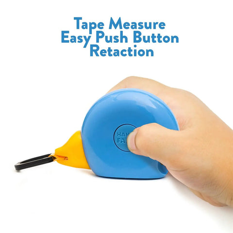 Hand holding kid friendly 8 foot tape measure with blue bird design STEM educational tool featuring level and protractor retractable and child safe vinyl case with backpack clip ideal gift for boys and girls 3 plus.