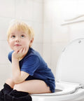 Child sitting on round toilet seat with built-in toddler seat for potty training. Fits adults and kids slow close quiet lid.