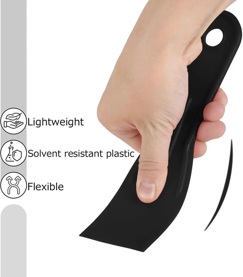 Person holding a black plastic putty knife from the Six Piece Plastic Putty Knife Set With Black And Yellow Handles For Smooth Spackle, Paint Scrapers, And Spreading On Walls And Ceilings, Durable Plastic Tools For Quick Repairs And DIY Projects next to icons for lightweight, solvent resistant, and flexible features.