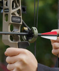 Whisker Biscuit Arrow Rest For Compound And Recurve Bows, Capture Brush Design in use with camouflage finish, close-up view.
