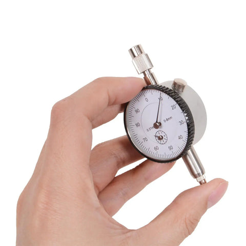 Hand holding Precise TDC Dial Indicator Timing Gauge Kit For Motorcycle Ignition Adjustment And Piston Top Dead Center Alignment