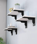 Badass Black Industrial Floating Shelf Brackets Two Pack Dead Reliable Thick Steel L Corner Wall Mounts Built Tough Garage Kitchen Storage Hardware No Sweat Install - Installed shelves displaying decor.