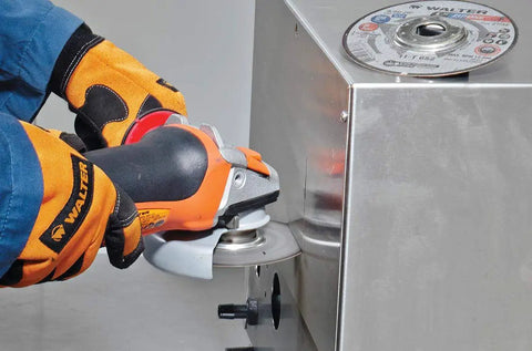 Worker using Cutoff Wheel ZA-60 Grit For Thin Gauge Metal With Seven Eighths Inch Arbor Ultra Thin for metal cutting