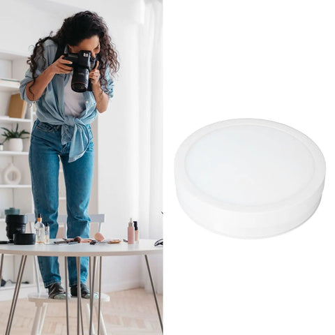 Depisuta 22cm Electric Rotating Turntable Display Stand With Led Colorful Light remote control in a photography setup.