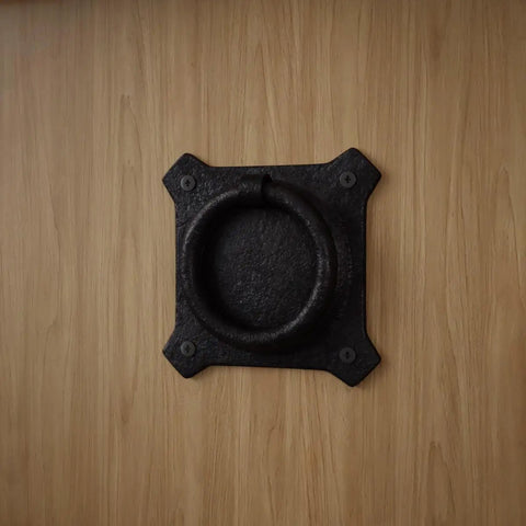 Premium Mission Style Wrought Iron Cabinet Ring Pull 2 Inch Antique Drop Handle with matte black finish on wood.