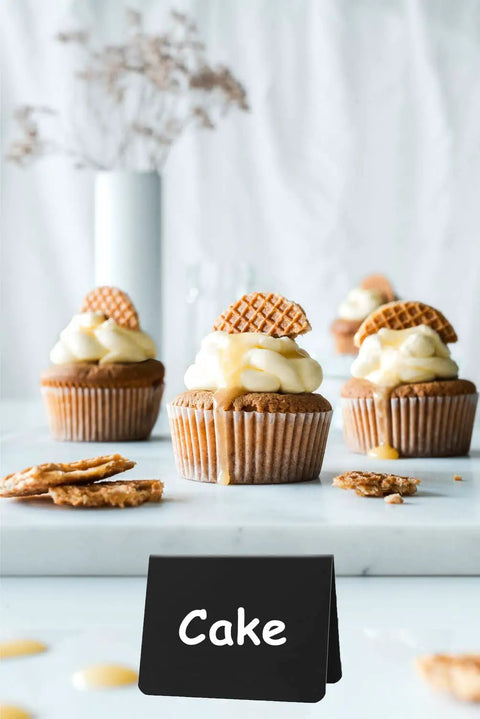 Chocolate cupcakes on display with 20 Piece Mini Chalkboard Signs For Food, Reusable Buffet Table Labels showing 'Cake'.