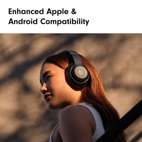 Person wearing Studio Pro Premium Wireless Over Ear Headphones With Up To 40 Hour Battery Life And Active Noise Cancellation