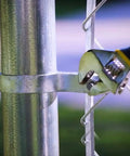 Heavy Duty 1 3/8 Inch Chain Link Fence Gate Post Hinge Set Built Tough Galvanized Carbon Steel 4 Pack For 32mm Pipe Panels Male And Female Hinges Max Load 220 Lb Fits 1 3/8 Inch Posts Easy Install being installed on a chain link fence post with a wrench.