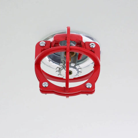 Bulldog Tough Fire Sprinkler Head Cage Guard and Protector for 1/2 Inch Iron Pipe in Bright Red Finish mounted on ceiling.