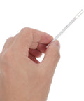 Hand holding a Heavy Duty Ceramic Soldering Iron Element Core White Replacement Heating Core for electronics repair.