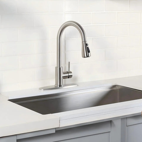 Heavy Duty Kitchen Faucet With Smooth Pull Down Sprayer In Top Shelf Brushed Nickel Rust Resistant Steel Body mounted in a modern kitchen sink.