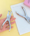 Compact Single Hole Punch Metal Circle Punch For Scrapbooking And Office Use 6mm Puncher displayed on a desk with notebook