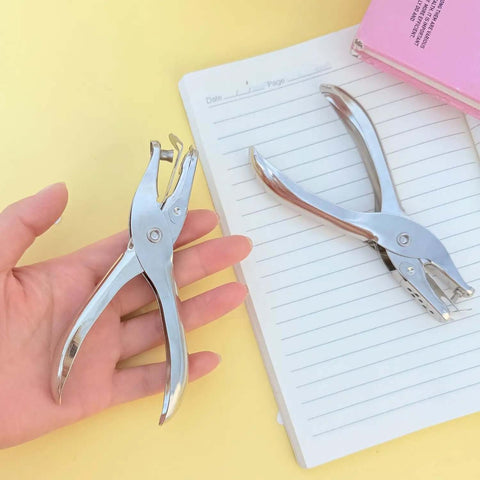 Compact Single Hole Punch Metal Circle Punch For Scrapbooking And Office Use 6mm Puncher displayed on a desk with notebook