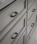 Lombard 3 Inch Center To Center Matte Black Cabinet Handles on gray dresser drawers for modern hardware update.