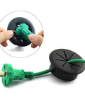 Flexible Desk Cord Grommet Pair Black Wire Organizer Hole Covers manage and hide PC desktop cables with a green plug