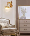 Modern Brass Wall Sconces With Glittering Acrylic Jewel Drops For Bedroom Living Room Hallway Lighting Energy Saving Decor Fixture, mounted beside a vintage chair.