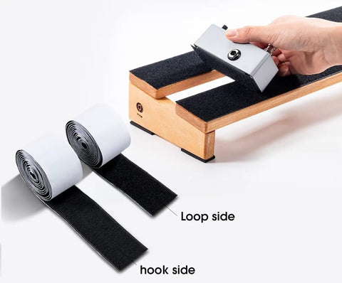 Guitar Pedalboard Velcro Mounting Tape 2m Long By 5cm Wide For Securing Effects Pedals with hand applying pedal on board.