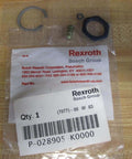 Hydraulic seal kit P-028905-K0000 P028905K0000 components on table with OEM packaging visible