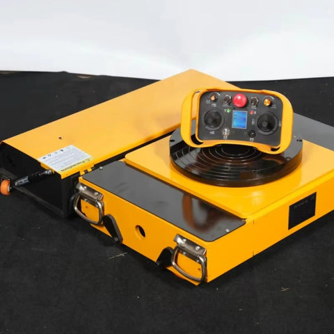 Heavy Duty Battery Powered Machinery Transport Dolly With Wireless Remote Control That Picks Up Massive Loads In Beast Mode on black surface.