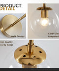Mid Century Modern Globe Wall Sconce in brushed brass with clear glass bubble ball lampshade and gold canopy detail