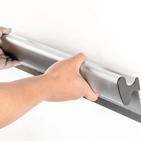 Using Pro Grade Drywall Skimming Blade Set With Extension Handles For Quick Finishes Includes 12 20 And 32 Inch Blades on wall