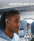 Person wearing Liberty 4 NC Wireless Earbuds With Ninety Eight Point Five Percent Noise Reduction Adaptive Noise Cancelling on a train.