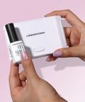 Person holding GelShift Transformative Top Coat and Foldable UV Lamp Set For Gel Nails Quick 60 Second Cure