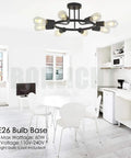 8 Light Sputnik Ceiling Light In Black Metal Modern Industrial Chandelier in a white kitchen with dining area.