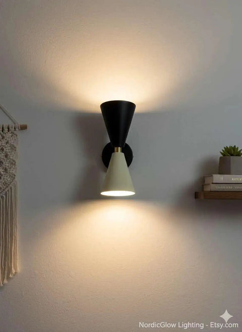 Mid-Century Two-Tone Cone Wall Sconce Light - Black & White Dual Funnel Wall Mounted Lamp with Gold Accent Ring - Up and Down Wall Lighting Fixture for Living Room & Bedroom on a white wall.
