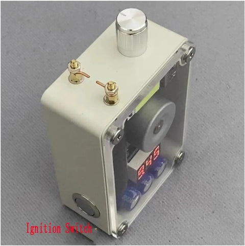 Handheld device with ignition switch and digital display showcasing electronics components.