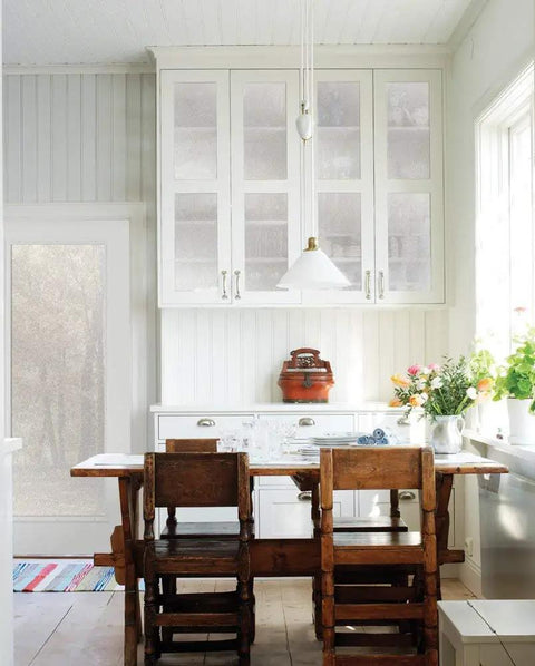 Kitchen with Self-Adhesive Privacy Glass Window Film Milky Tint 17 Inch By 78 Inch Roll 3-Pack With Applicator on cabinets and door.
