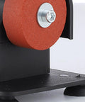 Close-up of red abrasive wheel on Smooth Operator Mini Bench Grinder For Home Shop Deburring Sharpening And Steel Polishing.