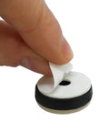 Heavy Duty 7/8 Inch Round Furniture Sliders Featuring Zero Friction Glide Tech For Slick Carpet And Wood Floor Moves While Shielding Surfaces From Scuffs Tan 8 Pack being peeled off a protective layer for easy application.