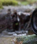 Batis 18mm F/2.8 Wide Angle Lens For Sony E Mount Full-Frame Cameras, weatherproof on moss beside stream