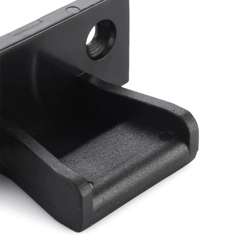 Close-up of a black connector from the 10 Pack Push In Panel Connectors For Furniture Quick Fit Bracket Clips For Kitchen Cabinets