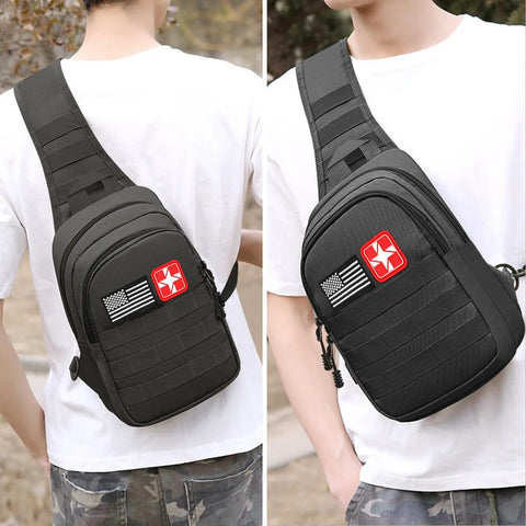 Black tactical sling bag for outdoor survival with red cross and US flag patches.
Black tactical sling bag side view showing MOLLE-style webbing and padded strap.