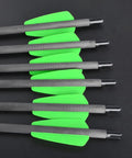 Close-up of 15 Inch Carbon Crossbow Bolts with green fletching, 100 Grain Removable Tips, Moon Nocks, Pro Grade Durable Shafts