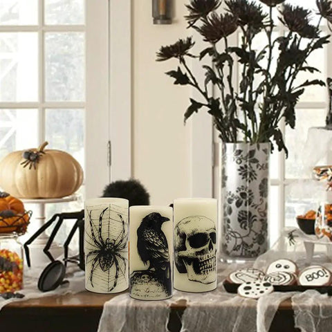 Halloween LED Flameless Candles 3 Pack With 6 Hour Timer Battery Operated 3 Inch Diameter By 6 Inch Height Spooky Decals Featuring Crow Raven Spider On Web And Skull Indoor Halloween Decor For A Chill Haunted Vibe on table setting