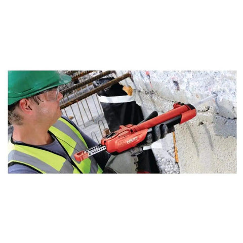 Worker using HY 200-R Injectable Mortar Two-Pack for Fast-Setting Concrete and Masonry Repairs on a wall crack.