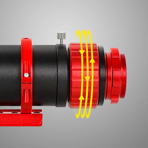 Close-up of Smart Guide Guider For Telescopes 50ED 50 By 240 F four point eight showing red adjustable ring for precise guiding.