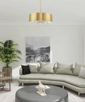 Gorgeous Six Light Pendant Featuring Brushed Nickel Drum Shade And Clear Faceted K9 Crystals illuminating a cozy living room.