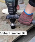 Person using electric hammer with Beefy Pro Grade Heavy Duty Rubber Hammer Heads for leveling sheet metal, SDS Plus Shank Tool Accessory.