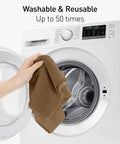 Front view: Fantasticlean tan microfiber cleaning cloth held in hand near open washing machine.