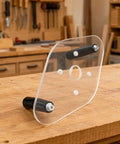Clear Acrylic Router Base Plate With Reinforced Dual Handles For Compact Routers Rock Solid Stability And Smooth Sailing Cuts For Fine Woodworking Enthusiasts Knockout Clarity on wooden workbench.