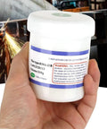 Person holding a 100g container of RMA 218 Flux Paste For BGA Reballing And Soldering, Pro Grade High Performance Solder Paste