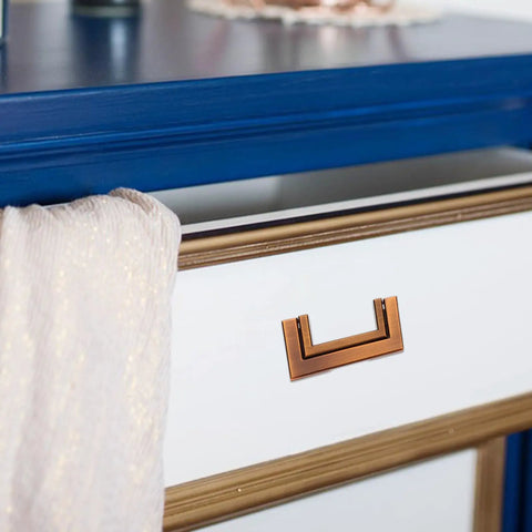 Hidden Drawer Pull Handles In Zinc Alloy Antique Brass Cabinet Pulls on white drawer with blue top