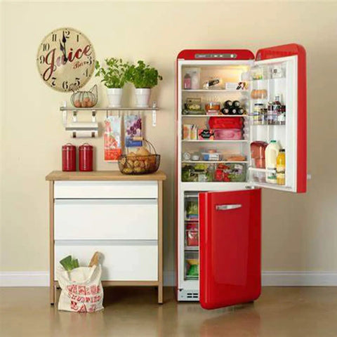 Red fridge open with groceries next to a cabinet, related to Refrigerator Compressor Relay And Overload Kit 5 Pack.
