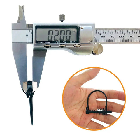 Measuring 0.200 in with caliper next to 24 Pack Heavy Duty Shaft Locking Pins With Drop Dead Silent Springs for Tree Stands.